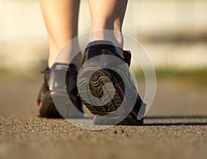 Sports female in black running shoes