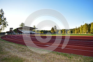 Sports field with rubberized track