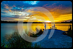 Sports Fishermen at Sunset early fall with beautiful skyline over Ed Zorinsky lake Omaha Nebraska