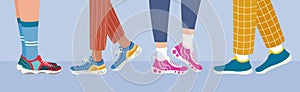 Sports footwear banner. Legs in sneakers side view. Healthy lifestyle concept. Women and men walking in sneakers. Daily activity.