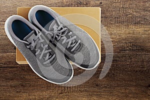 Sports footwear on wooden background