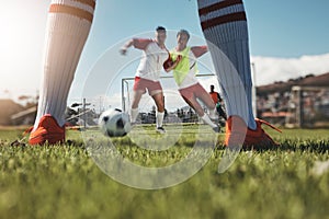 Sports game, football field action and legs of soccer player in competition, fitness practice or cardio health workout