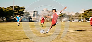 Sports game, soccer and child shooting, kick or strike ball to score winning goal in contest, competition or match