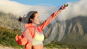 sports girl proudly raises her hand with medal, the champion celebrates victory