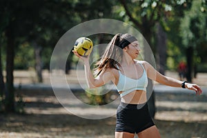 Sports Girls Having Fun and Throwing Ball in the Park on a Sunny Day