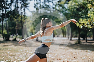 Sports girls throwing and catching a rugby ball while having fun and staying fit.