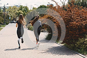 Sports girls training in a summer forest