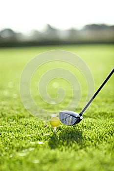 Sports, golf ball and tee for practice on field for motivation for challenge, target and hole. Course, equipment and