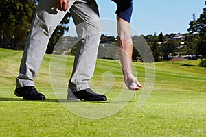 Sports, golf hole and person with ball on course playing game, practice and training for competition. Professional