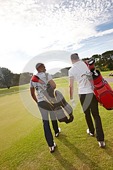 Sports, golf and men on field walking for game, match and competition on golfing course. Recreation, hobby and athlete