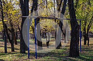 A sports ground in the city`s fall park. Parallel bars, gymnasti