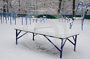 The sports ground is covered with white snow