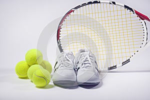 Sports Images Concepts: Tennis Raquet, Tennis Balls and Trainers photo