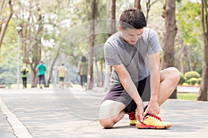 Sports injury. Man with pain in ankle while jogging