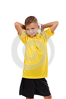 Sports kid isolated on a white background. Cute boy with a soccrr ball. Young football player. Active childhood concept.