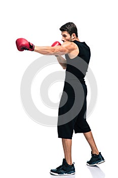 Sports man boxing in red gloves