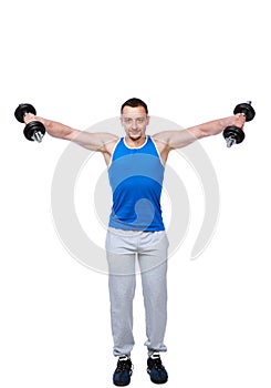 Sports man doing exercises with dumbbells