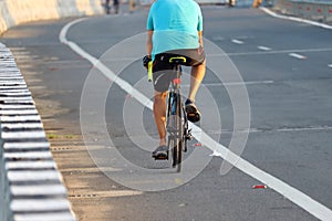 A sports man enjoying morning cycling on Nation Highway Road