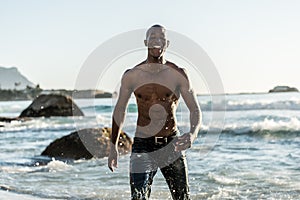 Sports man running in water