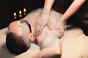 Sports massage. Breast massage. Physiotherapist doing a male breast massage to an athlete to a patient.