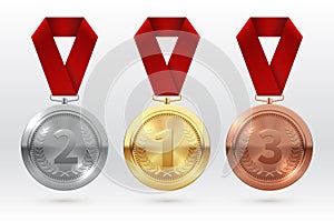 Sports medals. Golden silver bronze medal with red ribbon. Champion winner awards of honor vector isolated template photo