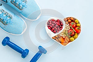 Sports nutrition diet. Healthy food with fitness equipment