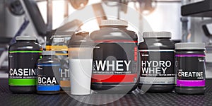 Sports nutrition supplements and chemistry for bodybuilding in gym. Whey protein casein, bcaa, creatine cans