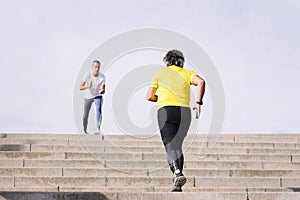 sports old man training on stairs with trainer