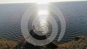 Sports on open air, pugilist men conducts boxing training on beautiful nature near sea with shiny water against sky in