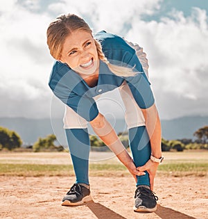 Sports, pain and woman with leg injury on baseball pitch alone. Fitness, training and a player with hurt ankle. Accident