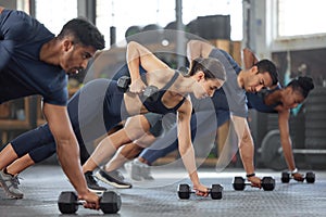 Sports people fitness training with weights at gym, workout exercise and being active at health center. Team of men and