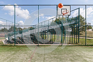 Sports playground for basketball and football by the mountains