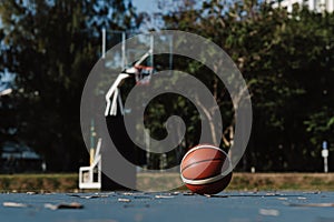 Sports and recreation concept a round basketball laying down on the floor of a basketball court