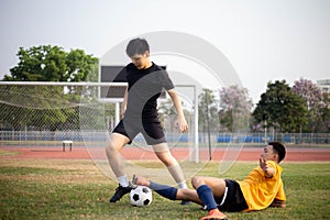 Sports and recreation concept two male soccer players attending regular practice sessions and memorizing attack and defense