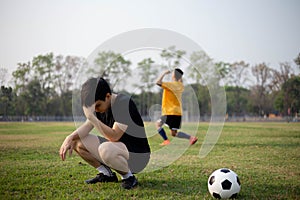 Sports and recreation a moment of victory and defeat of two players after the football match