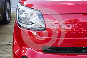 Sports red car front view, close-up