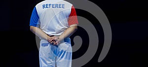 Sports referee on a black background