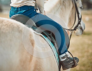 .Sports, riding and shoes of girl on horse in countryside for hobby, equestrian and learning. Cowgirl, summer and