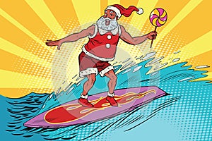 Sports Santa Claus on a surfboard