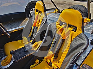 sports seats in the vehicle. multi-point belts protect racers in a