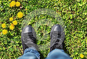 Sports shoes on a fresh green grass.