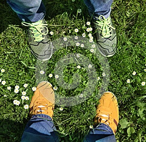 Sports shoes on green grass