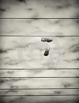 Sports Shoes Hanging from Power Lines