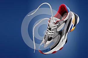 sports shoes, sports sneakers on a blue background with space for the inscription