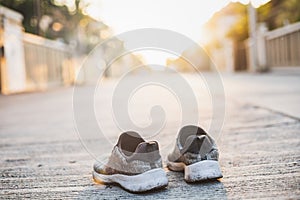 Sports shoes on street background.Metaphor Fitness and workout concept exercise Health lifestyle muscle with  take care of your