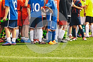 Sports Soccer Kids Teams. Many Sports Football School Age Players Standing Together on a Line. Colourful Kids Sports Clothing