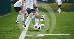Sports Soccer Players on Training. Boys Kicking Soccer Balls on Practice Session