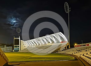 Sports Stadium and Floodlights Lit Up at Night time