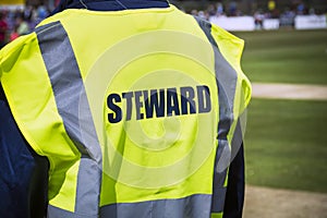 Sports steward by pitch in high viz jacket photo