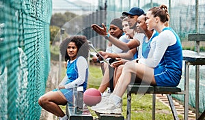 Sports, talking and coach with women at netball, training and watching a game for planning. Teamwork, learning and man